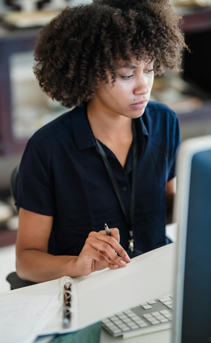 Professional woman writing and working on documents